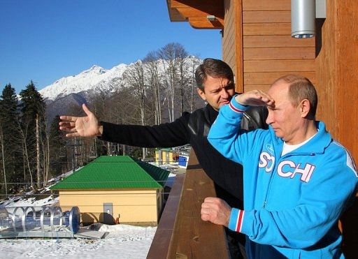 Vladimir Putin (R) speaks with regional governor Alexander Tkachev in Krasnaya Polyana outside Sochi on January 3, 2013